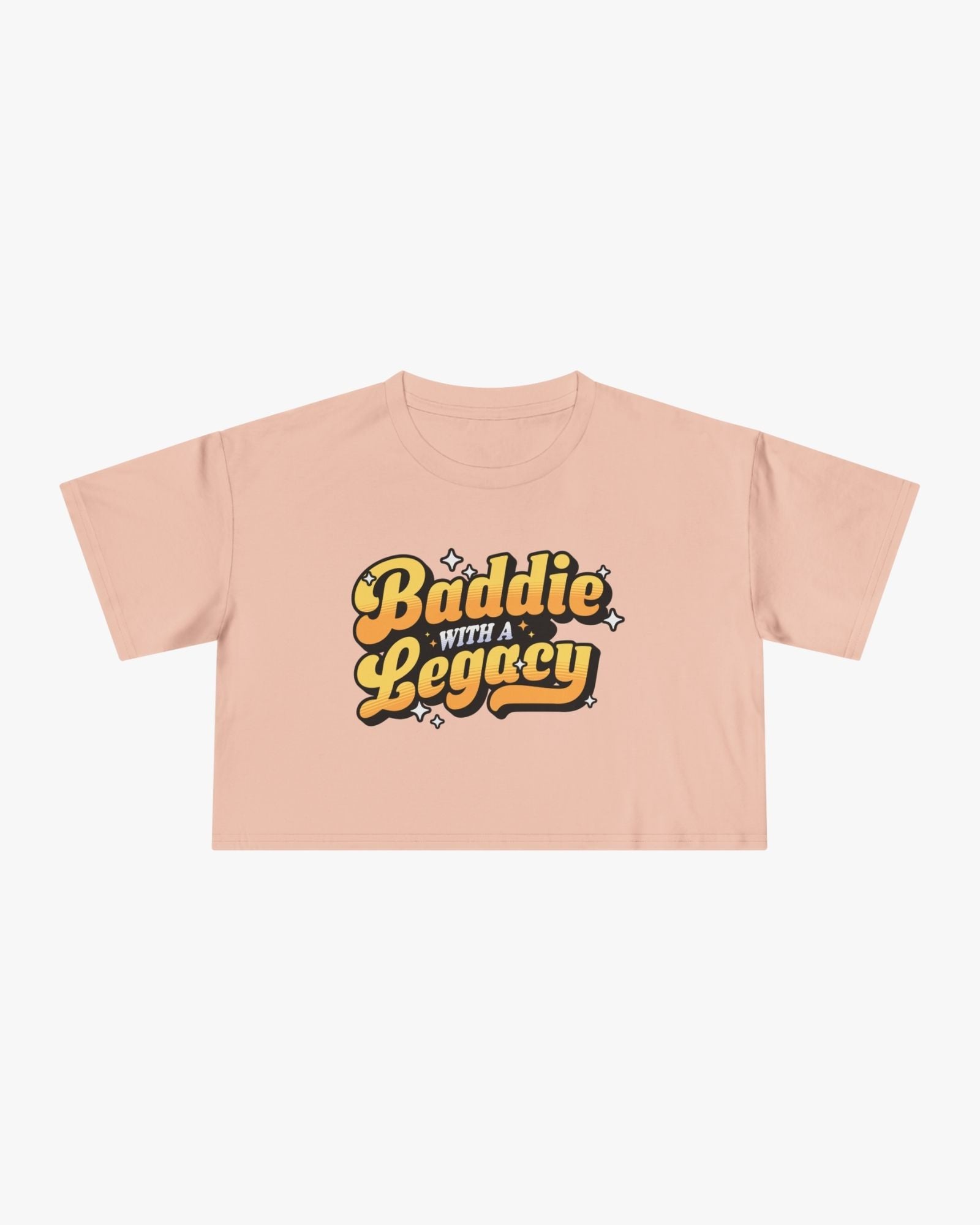 Pink crop top with 'Baddie with a Legacy' text on a white background