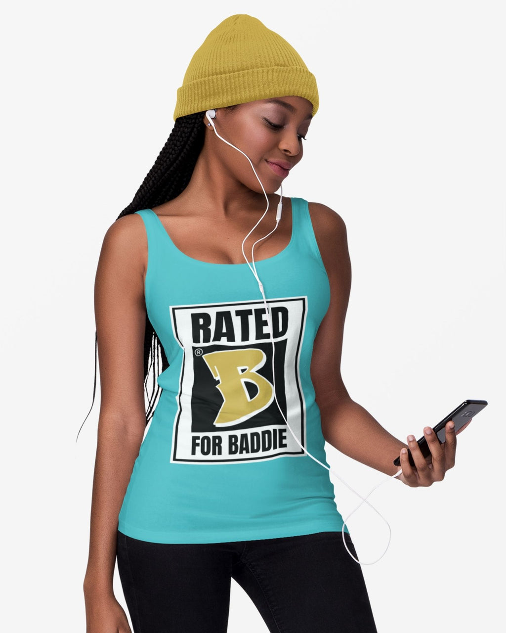 Woman wearing a turquoise tank top with 'Rated B for Baddie' graphic, yellow beanie, and black pants, holding a phone.