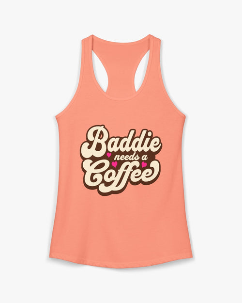 Peach-colored tank top with 'Baddie needs a coffee' text on a white background