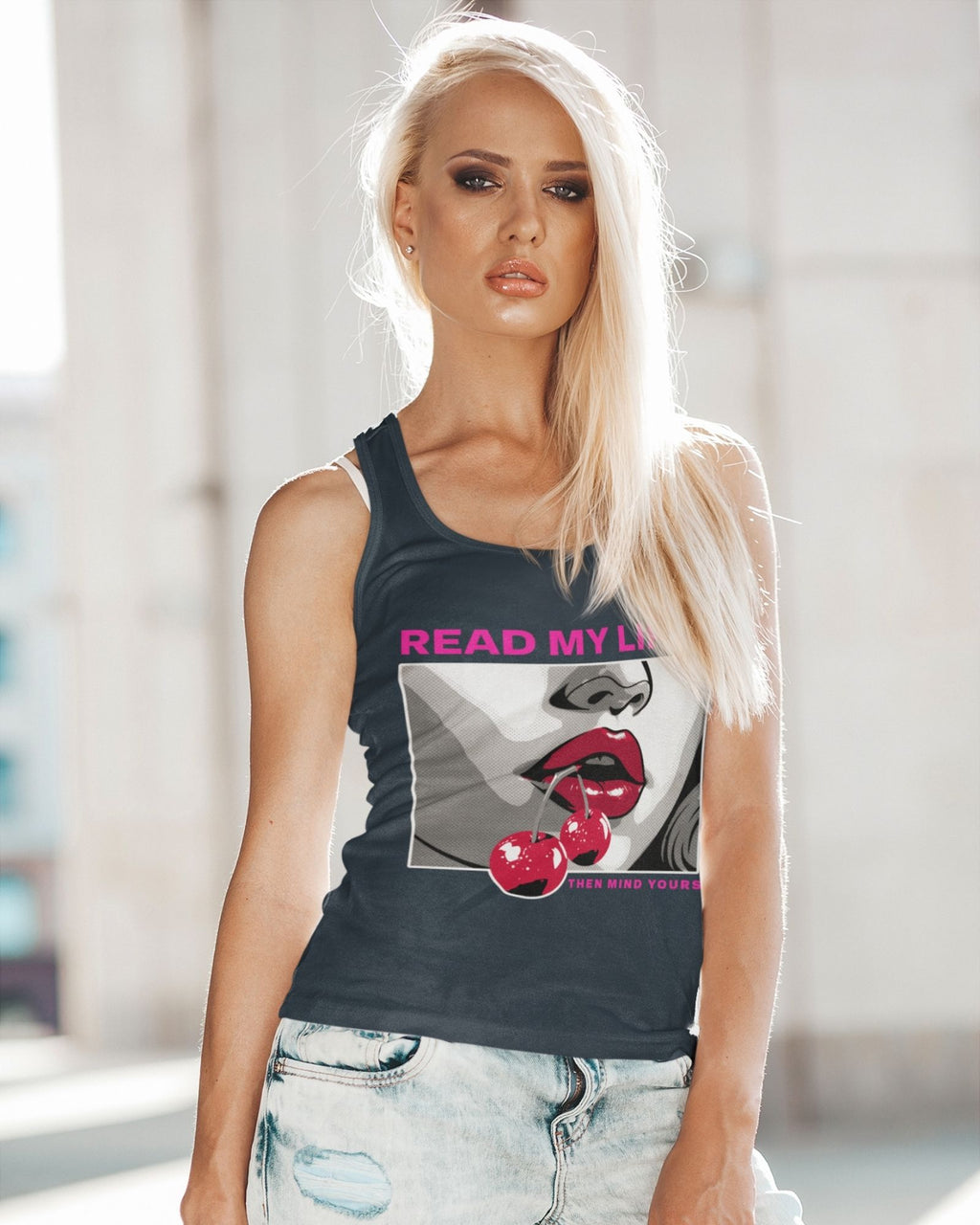Woman wearing a tank top with graphic design and text