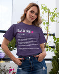 Person wearing a purple t-shirt with 'BADDIE' definition text