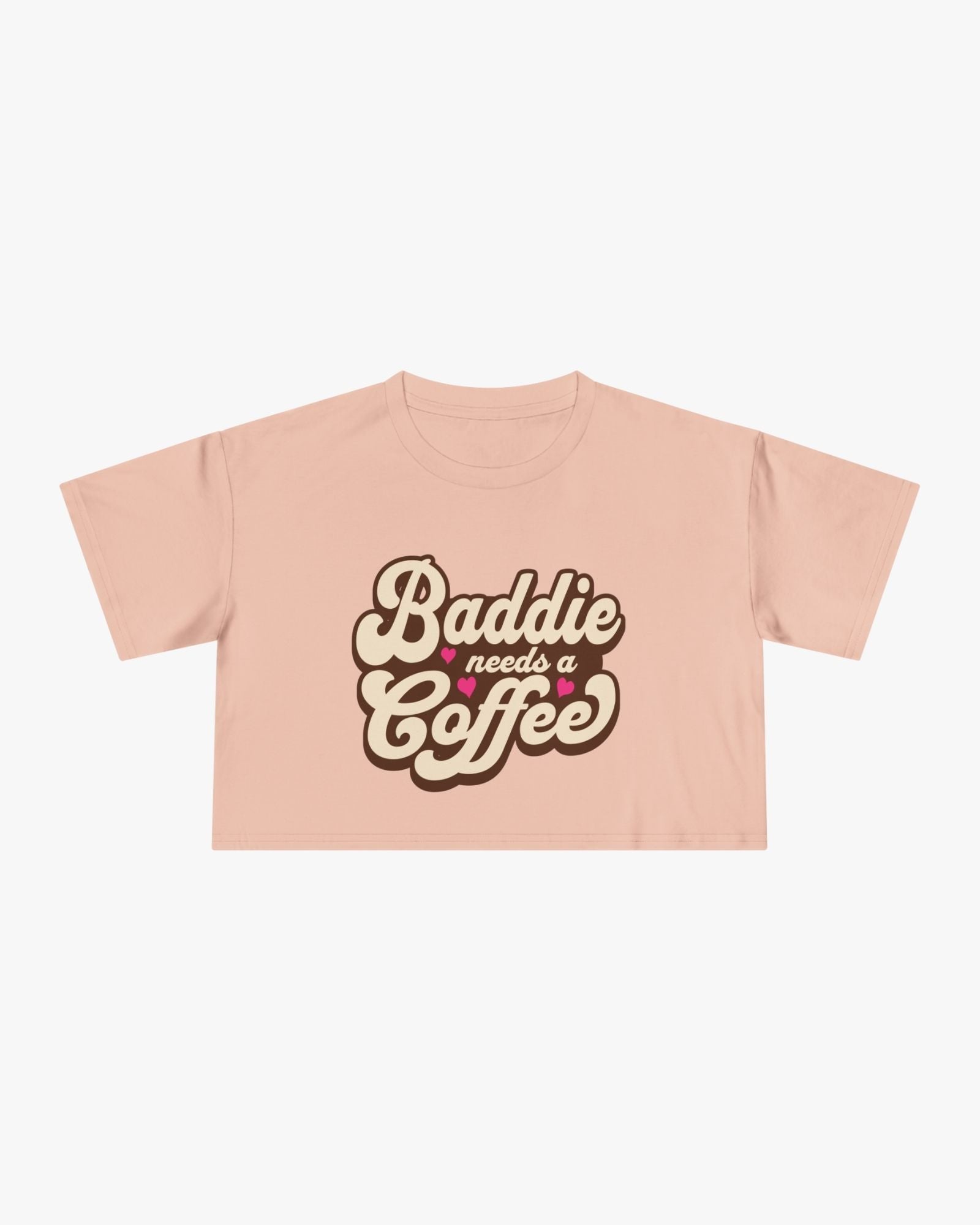 Pink t-shirt with 'Baddie needs a Coffee' text on a white background