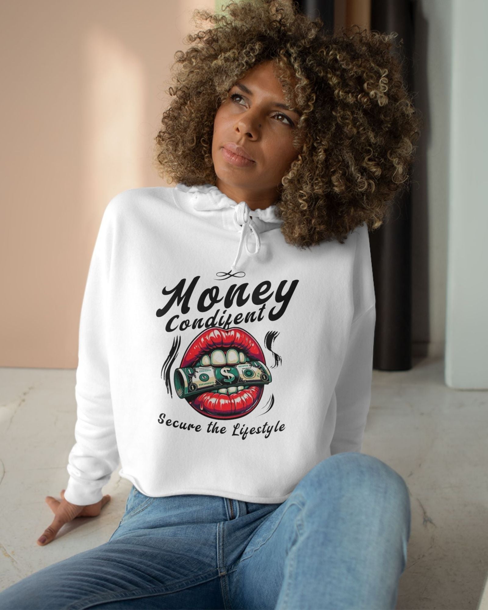 Woman wearing a white hoodie with a graphic design and text.