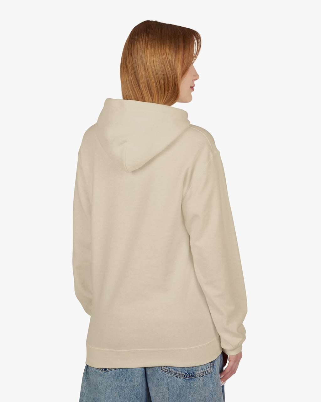 Person wearing a beige hoodie on a white background